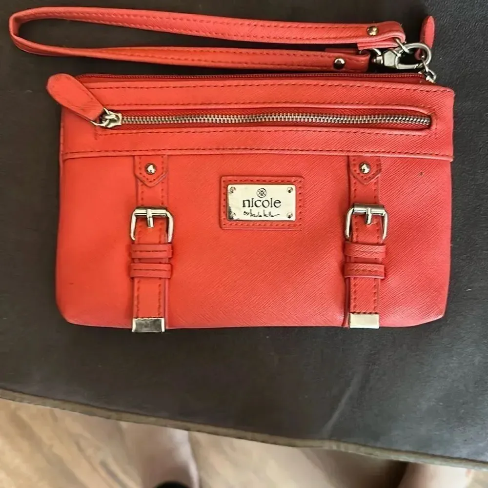Nicole by Nicole Miller salmon colored Wristlet with Gold Details